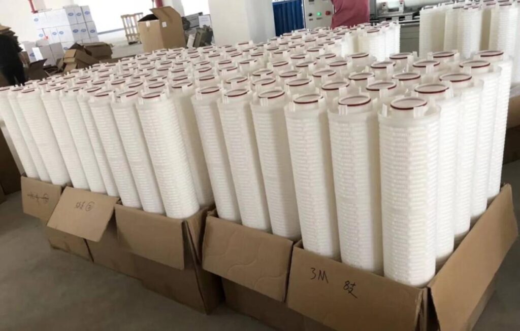 A side-by-side comparison of an OEM and a high-quality replacement high flow filter