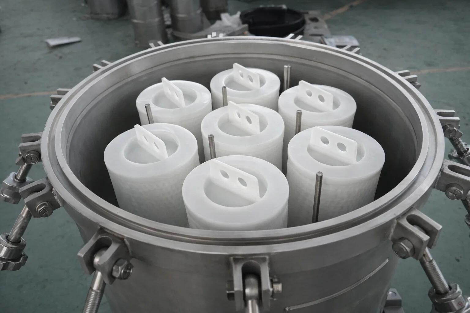 A photo of an operator easily changing a single High Flow filter cartridge in a user-friendly housing