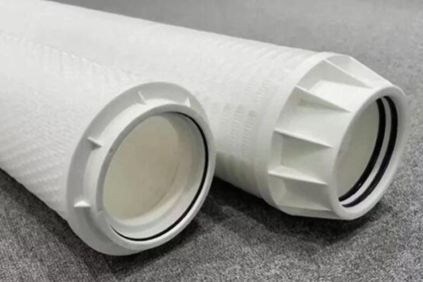 A pressure gauge on a filter housing showing the needle in the red 