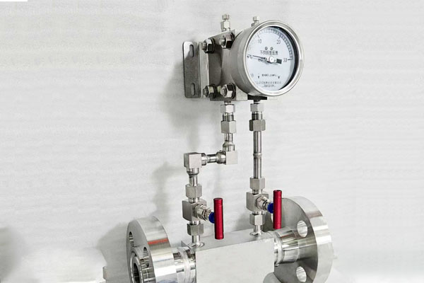A pressure gauge showing a high differential pressure reading on a filter housing