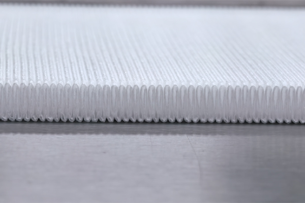 Illustration comparing standard pleat spacing with wider, asymmetric pleat spacing