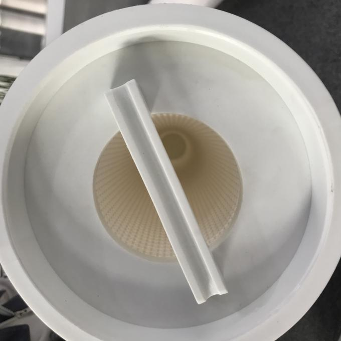 Heat-Resistant Filter Core Close-up of a reinforced filter cartridge core next to a warped one